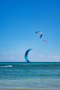 affordable prices people parasailing in the ocean